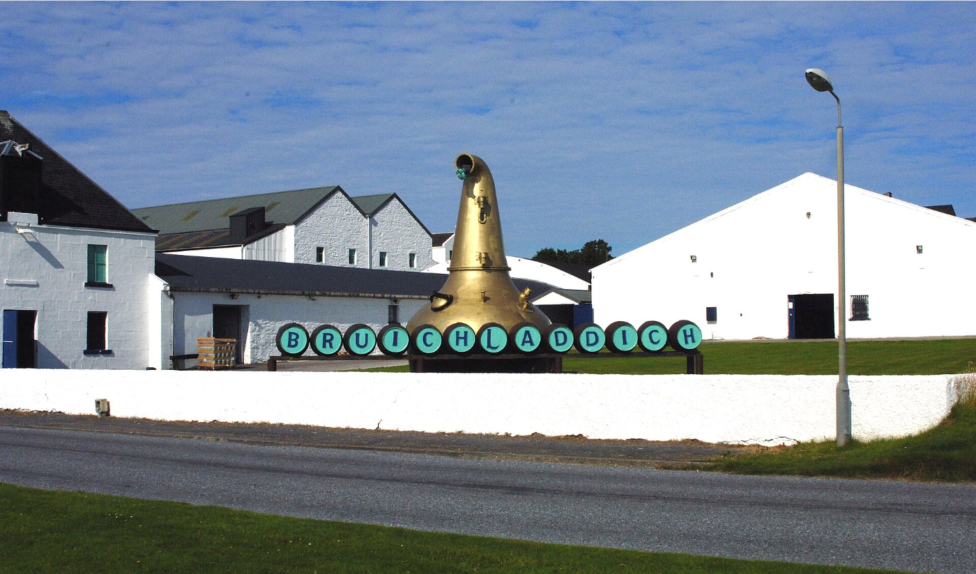 Bruichladdich Distillery on the shores of Loch Indaal. Home to three distinct spirits: unpeated Bruichladdich, consistently peated Port Charlotte, and ultra-peated Octomore
