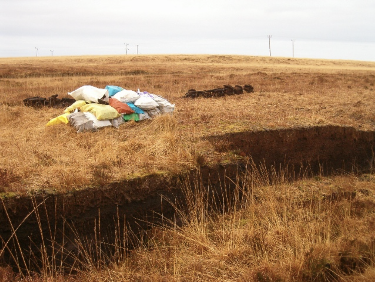 Turf cutting on Islay — peat is still cut by hand for fuel and malt-drying on the island, using methods largely unchanged for generations
