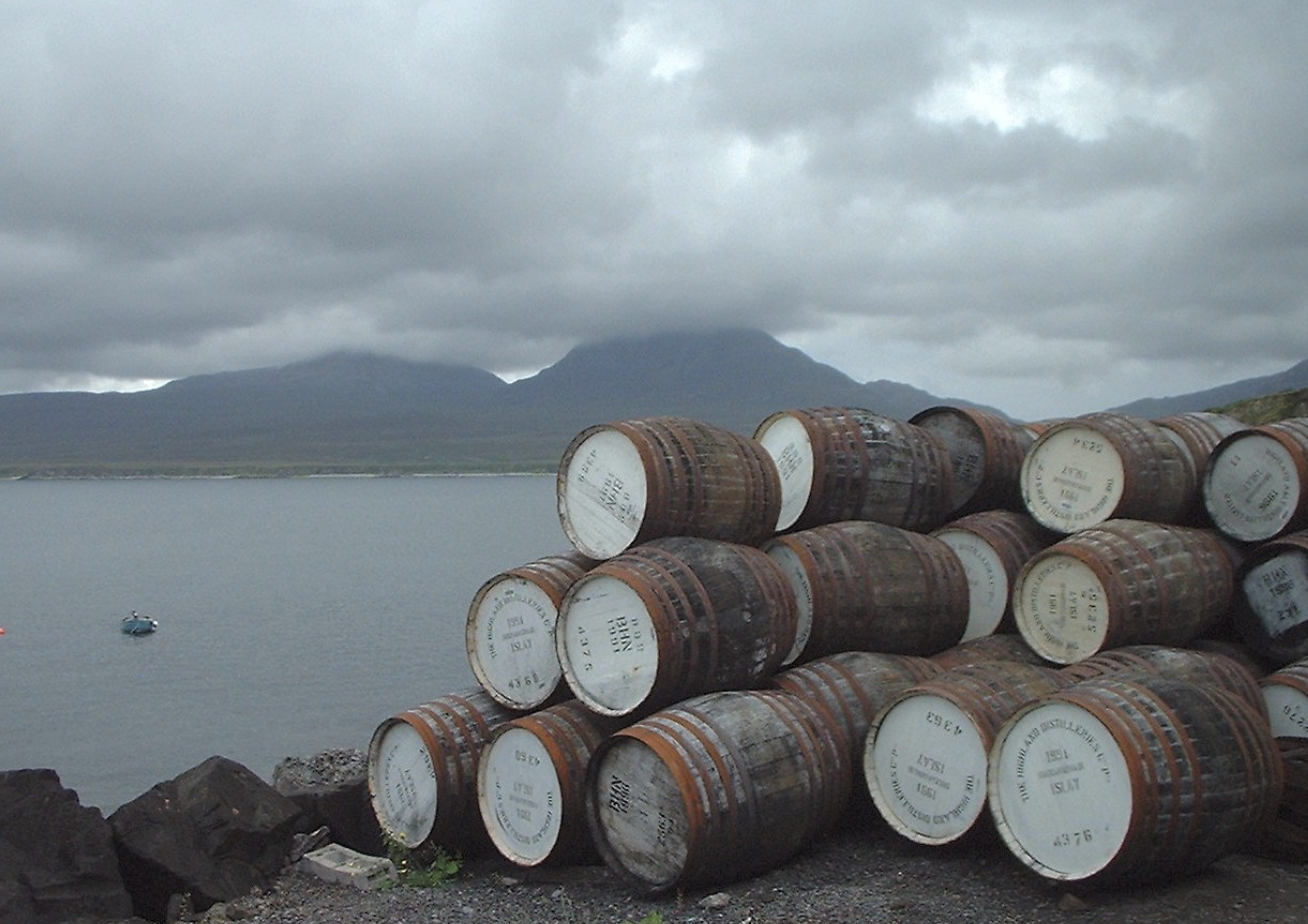 Whisky casks at Bunnahabhain, with the Paps of Jura across the Sound of Islay.